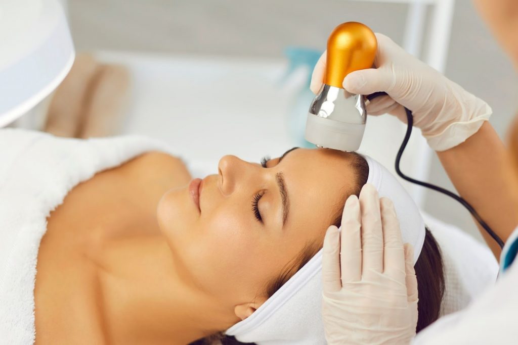 A woman receiving an Ultherapy treatment