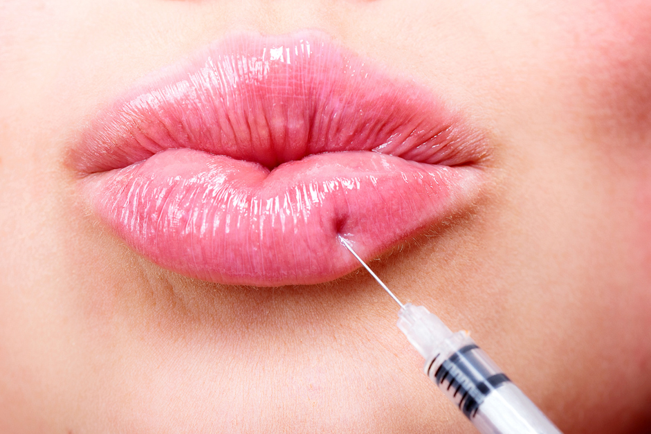 Injector consulting with a patient about filler correction options